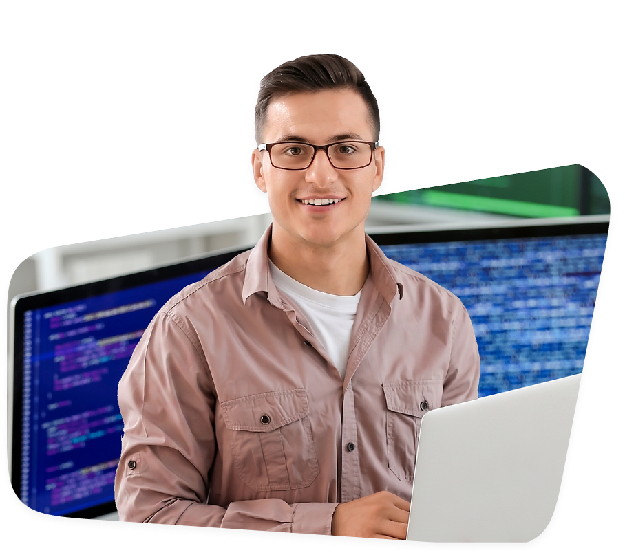 Developer working on a laptop with code on the screen